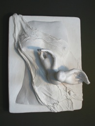 A plaster relief sculpture