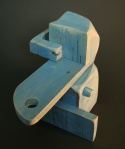 A small wooden abstract sculpture